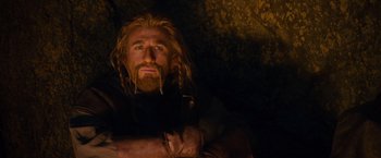 Movie still from “The Hobbit: An Unexpected Journey” (2012), directed by Peter Jackson – A man with long hair and a beard is posing for a picture; Close Up shot, Low angle