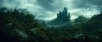 Movie still from “The Hobbit: An Unexpected Journey” (2012), directed by Peter Jackson – A castle on top of a hill in the middle of a forest; Extreme Wide shot, Low angle
