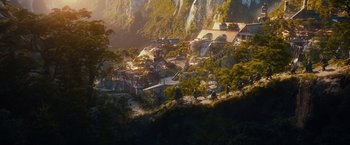 Movie still from “The Hobbit: An Unexpected Journey” (2012), directed by Peter Jackson – A view of a mountain with a bunch of people on it; Extreme Wide shot, High angle