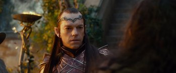 Movie still from “The Hobbit: An Unexpected Journey” (2012), directed by Peter Jackson – A person with long black hair; Close Up shot, Over the shoulder angle