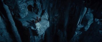 Movie still from “The Hobbit: An Unexpected Journey” (2012), directed by Peter Jackson – A group of people sitting on top of a cliff; Extreme Wide shot, High angle