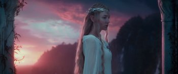 Movie still from “The Hobbit: An Unexpected Journey” (2012), directed by Peter Jackson – A woman with long blonde hair wearing a white dress; Medium shot, Low angle