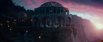 Movie still from “The Hobbit: An Unexpected Journey” (2012), directed by Peter Jackson – An ornate structure sits on top of a hill; Extreme Wide shot, High angle