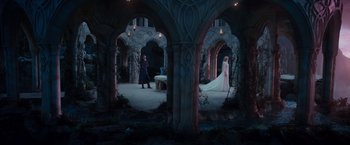 Movie still from “The Hobbit: An Unexpected Journey” (2012), directed by Peter Jackson – Two people standing in an archway in a castle; Wide shot, High angle