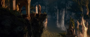 Movie still from “The Hobbit: An Unexpected Journey” (2012), directed by Peter Jackson – Two people standing on a cliff looking at a waterfall; Extreme Wide shot, Low angle