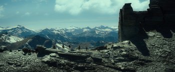 Movie still from “The Hobbit: An Unexpected Journey” (2012), directed by Peter Jackson – A group of people standing on top of a mountain; Extreme Wide shot, High angle