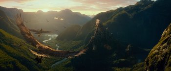 Movie still from “The Hobbit: An Unexpected Journey” (2012), directed by Peter Jackson – An eagle flying over a mountain with a river below; Extreme Wide shot, Low angle