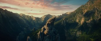 Movie still from “The Hobbit: An Unexpected Journey” (2012), directed by Peter Jackson – A view of a mountain range with birds flying overhead; Extreme Wide shot, High angle