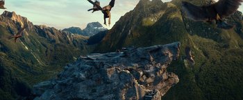 Movie still from “The Hobbit: An Unexpected Journey” (2012), directed by Peter Jackson – A man flying through the air over a cliff; Extreme Wide shot, High angle