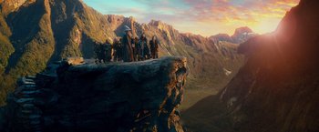 Movie still from “The Hobbit: An Unexpected Journey” (2012), directed by Peter Jackson – A group of people standing on top of a cliff; Extreme Wide shot, Low angle