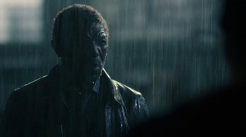 Movie still from “Daredevil” (2015), created by Drew Goddard – A man standing in the pouring rain looking at the camera; Close Up shot, Over the shoulder angle