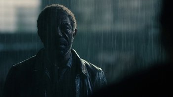 Movie still from “Daredevil” (2015), created by Drew Goddard – A person in a rain storm; Close Up shot, Over the shoulder angle