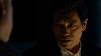 Movie still from “Daredevil” (2015), created by Drew Goddard – A person wearing a suit and tie; Close Up shot, Low angle