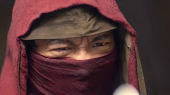 Movie still from “Daredevil” (2015), created by Drew Goddard – A man wearing a hood and looking at the camera; Extreme Close Up shot, Low angle