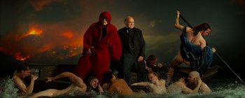 A group of people in the water with a man in a red robe