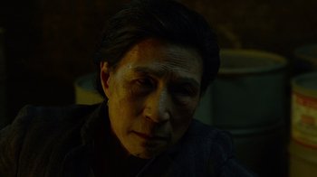 Movie still from “Daredevil” (2015), created by Drew Goddard – A man with dark hair is looking at the camera; Close Up shot, High angle