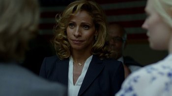 Movie still from “Daredevil” (2015), created by Drew Goddard – A person wearing a suit and tie; Close Up shot, Over the shoulder angle