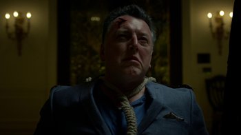 Movie still from “Daredevil” (2015), created by Drew Goddard – A man with a rope around his neck; Close Up shot, Low angle