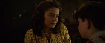 Movie still from “The House with a Clock in Its Walls” (2018), directed by Eli Roth – A young woman in a yellow and brown floral shirt; Close Up shot, Over the shoulder angle
