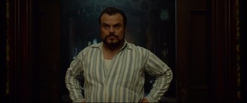 Movie still from “The House with a Clock in Its Walls” (2018), directed by Eli Roth – A person wearing a striped shirt; Medium shot, Low angle