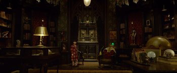 Movie still from “The House with a Clock in Its Walls” (2018), directed by Eli Roth – A young boy standing next to a living room; Wide shot, High angle