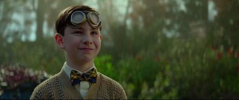 Movie still from “The House with a Clock in Its Walls” (2018), directed by Eli Roth – A young boy wearing a bow tie and goggles; Close Up shot, Over the shoulder angle