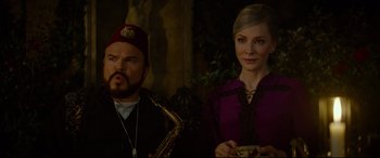 Movie still from “The House with a Clock in Its Walls” (2018), directed by Eli Roth – A man and a woman standing next to each other; Medium shot, Over the shoulder angle