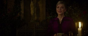 Movie still from “The House with a Clock in Its Walls” (2018), directed by Eli Roth – A woman in a purple shirt holding a cup; Medium shot, Over the shoulder angle