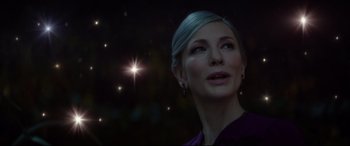 Movie still from “The House with a Clock in Its Walls” (2018), directed by Eli Roth – A woman in a purple shirt looking up at a star; Close Up shot, Low angle