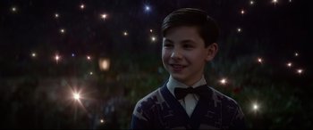 Movie still from “The House with a Clock in Its Walls” (2018), directed by Eli Roth – A young boy wearing a sweater and bow tie; Close Up shot, Over the shoulder angle