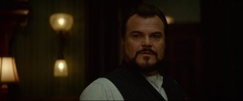 Movie still from “The House with a Clock in Its Walls” (2018), directed by Eli Roth – A person with a beard wearing a vest; Close Up shot, Low angle