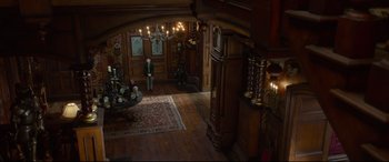 Movie still from “The House with a Clock in Its Walls” (2018), directed by Eli Roth – A room filled with wooden floors and walls; Extreme Wide shot, High angle