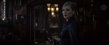 Movie still from “The House with a Clock in Its Walls” (2018), directed by Eli Roth – A woman in a black leather jacket holding a cane; Close Up shot, Over the shoulder angle