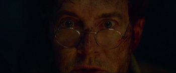 Movie still from “The House with a Clock in Its Walls” (2018), directed by Eli Roth – A person wearing glasses; Extreme Close Up shot, Low angle