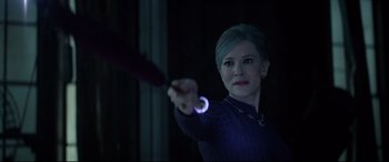 Movie still from “The House with a Clock in Its Walls” (2018), directed by Eli Roth – A woman is holding a wand in her hand; Close Up shot, Over the shoulder angle