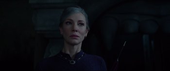 Movie still from “The House with a Clock in Its Walls” (2018), directed by Eli Roth – A woman in a purple shirt is looking at the camera; Close Up shot, Low angle