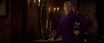 Movie still from “The House with a Clock in Its Walls” (2018), directed by Eli Roth – A woman standing in front of a mirror in a room; Medium shot, Over the shoulder angle