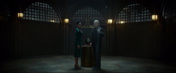 Movie still from “The House with a Clock in Its Walls” (2018), directed by Eli Roth – A man and a woman standing next to each other in front of a clock; Wide shot, Low angle