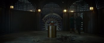 Movie still from “The House with a Clock in Its Walls” (2018), directed by Eli Roth – A woman standing in front of a clock in a room; Extreme Wide shot, Low angle