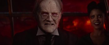 Movie still from “The House with a Clock in Its Walls” (2018), directed by Eli Roth – An old man wearing a suit and glasses; Close Up shot, Over the shoulder angle