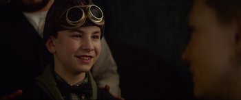 Movie still from “The House with a Clock in Its Walls” (2018), directed by Eli Roth – A young boy wearing goggles and a hat; Close Up shot, Over the shoulder angle