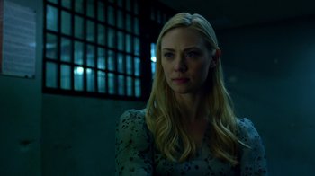 Movie still from “Daredevil” (2015), created by Drew Goddard – A woman with long blonde hair wearing a blue dress; Close Up shot, Over the shoulder angle