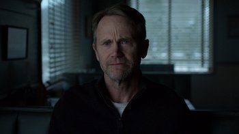 Movie still from “Daredevil” (2015), created by Drew Goddard – A person wearing a black jacket; Close Up shot, Over the shoulder angle