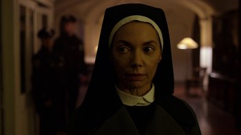 Movie still from “Daredevil” (2015), created by Drew Goddard – A woman dressed up as a nun in a dark room; Close Up shot, Low angle