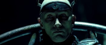 Movie still from “Dark City” (1998), directed by Alex Proyas – A person with a helmet on; Close Up shot, Overhead angle