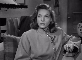 Movie still from “Dark Passage” (1947), directed by Delmer Daves – A black - and - white photo of lauren bacall in the 1 9 4 0 s; Close Up shot, Over the shoulder angle