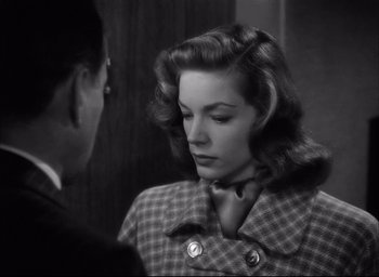 Movie still from “Dark Passage” (1947), directed by Delmer Daves – An old photo of a man and a woman looking at each other; Close Up shot, Over the shoulder angle