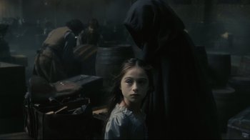 Movie still from “Dark Shadows” (2012), directed by Tim Burton – A young girl standing next to an older person; Medium shot, Over the shoulder angle