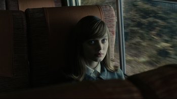 Movie still from “Dark Shadows” (2012), directed by Tim Burton – A woman sitting on a train looking out the window; Close Up shot, High angle