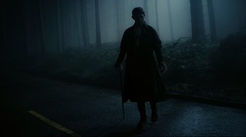 Movie still from “Dark Shadows” (2012), directed by Tim Burton – A person walking in the middle of a forest; Wide shot, Low angle